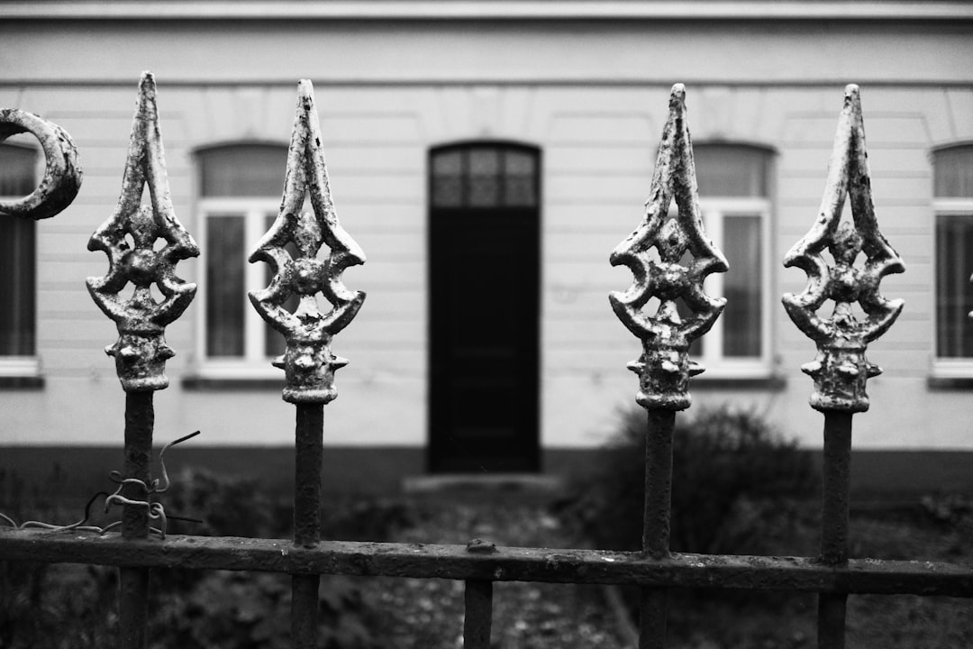 A hand holding a set of house keys