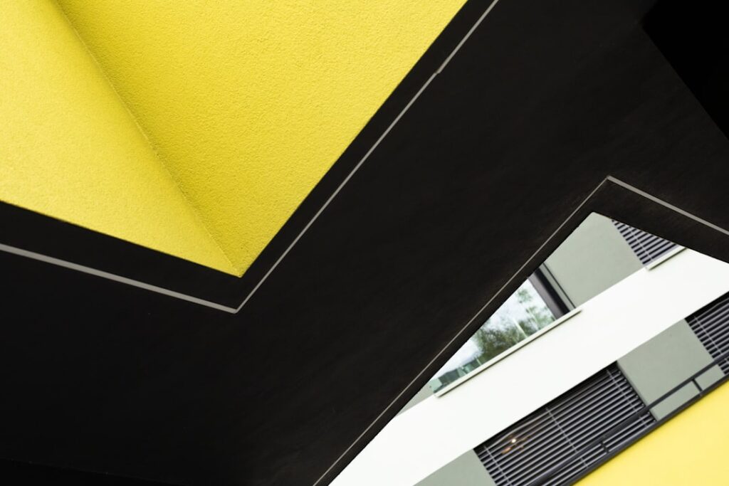 Clean, modern desk with architectural blueprints, a compass, and other drafting tools, suggesting city planning and develo...