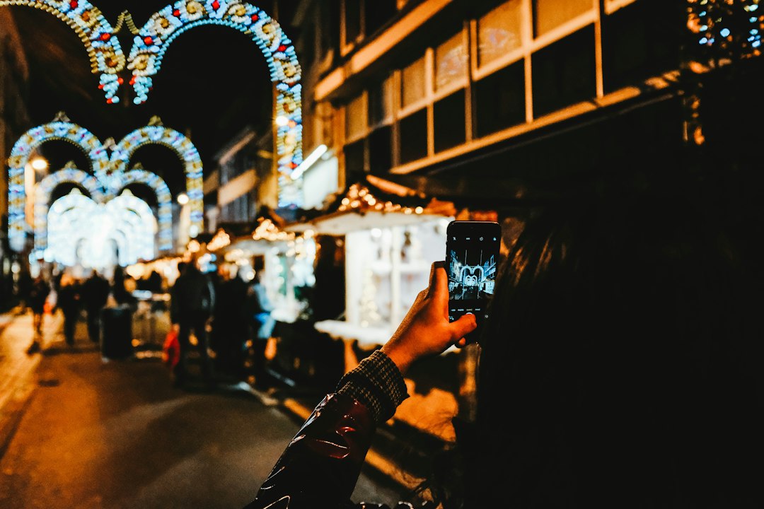 A close-up of a real estate expert holding a tablet displaying a glowing, data-rich map of a city, symbolizing digital strategy and AI.